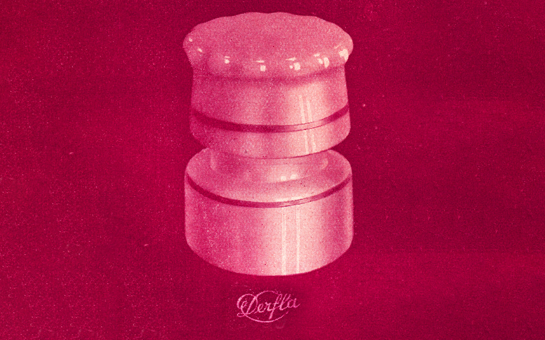 Round cap jar with lid, used for storing dental materials, shown against a red background.